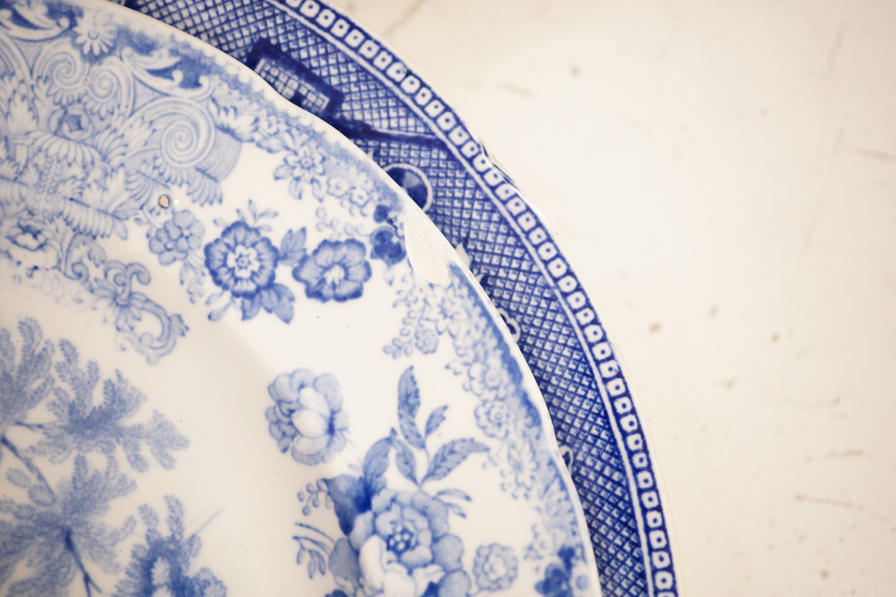A collection of mostly 19th century blue and white transfer printed pottery tablewares
